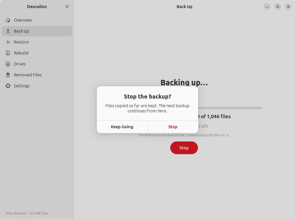 The dialog "Stop the backup? Files copied so far are kept. The next backup continues from here."
with Keep Going and Stop buttons.