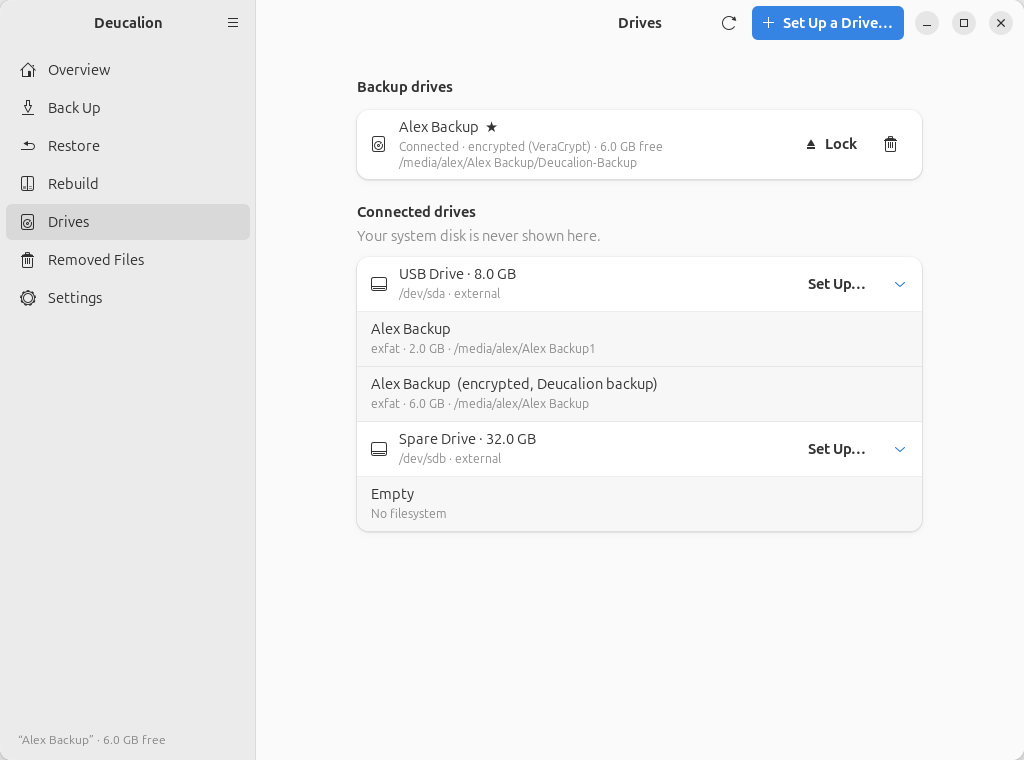 The Drives page: under "Backup drives", Alex Backup (default, starred), connected, encrypted with
VeraCrypt, with Lock and Forget buttons; under "Connected drives", USB Drive with its two
parts and Spare Drive, each with a Set Up… button.
