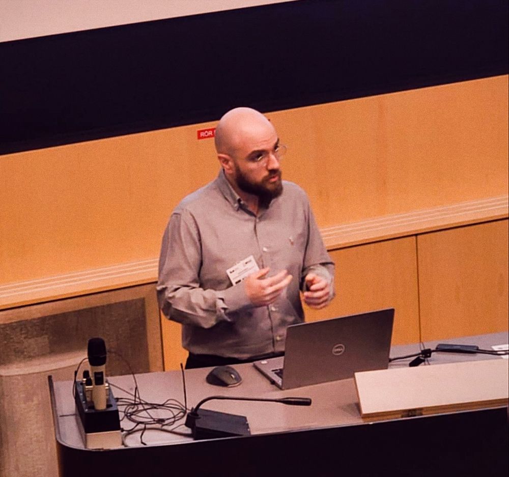 Dimitrios Kafetzis presenting a paper at a conference